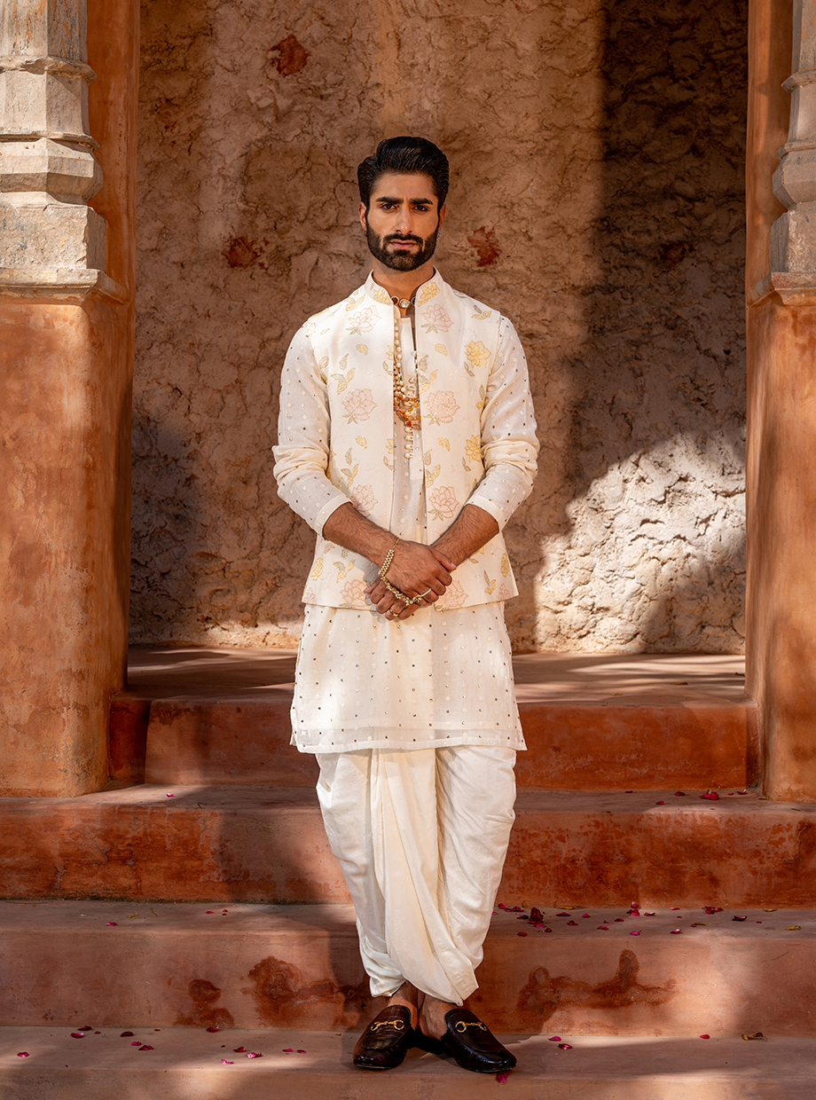 IVORY CHANDERI MUKAISH WORK KURTA + CHANDERI DHOTI PARIED WITH FLORAL EMBROIDERED BUNDI EXAGGERATED WITH SEQUIN WORK Nafsstore