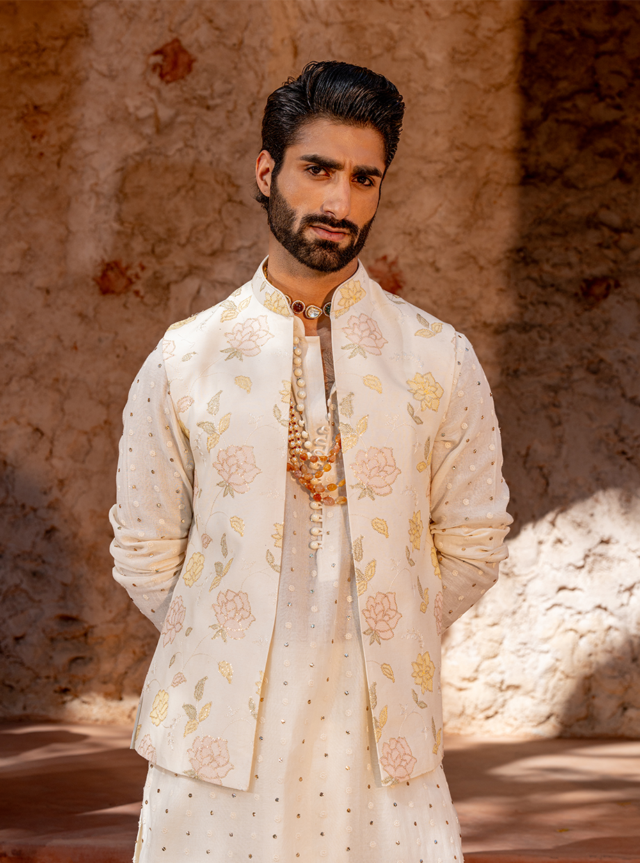 IVORY CHANDERI MUKAISH WORK KURTA + CHANDERI DHOTI PARIED WITH FLORAL EMBROIDERED BUNDI EXAGGERATED WITH SEQUIN WORK Nafsstore