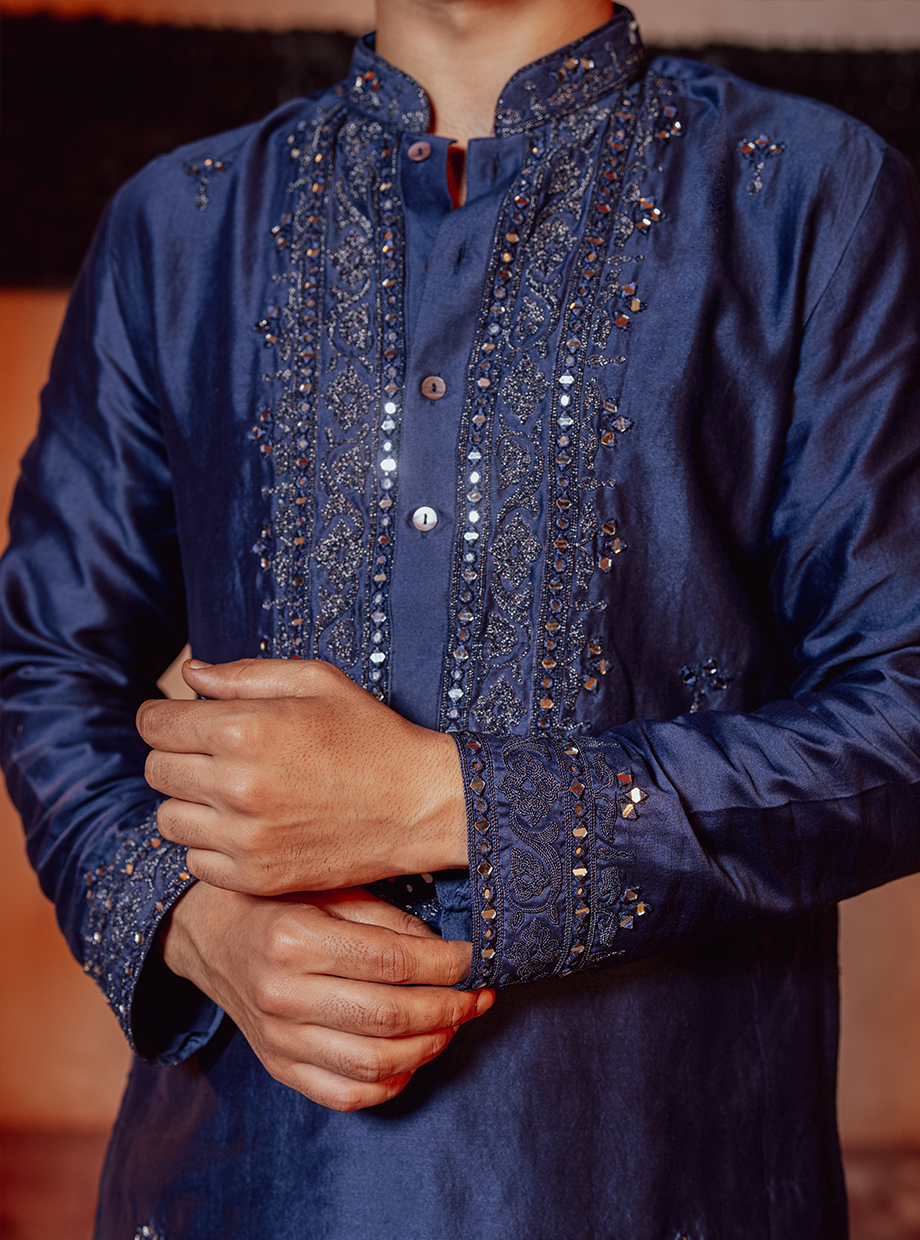 INDIGO BLUE KURTA EXAGGERATED WITH RESHAM, KASAB, DORI & MIRROR WORK PAIRED WITH IVORY CHANDERI PANT Nafsstore