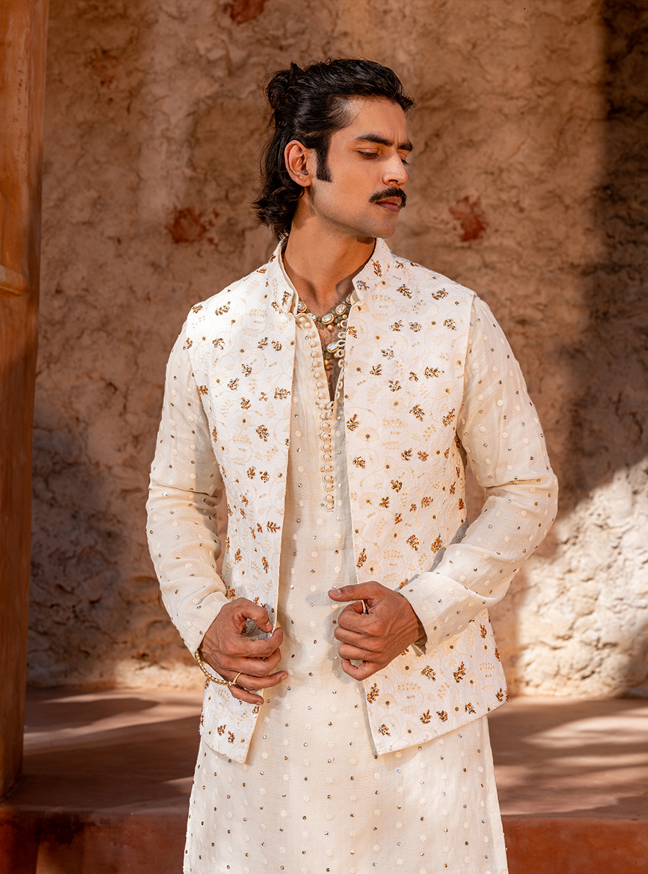 IVORY CHANDERI MUKAISH WORK KURTA + DHOTI PARIED WITH FLORAL EMBROIDERED BUNDI EXAGGERATED WITH MUKAISH FLORAL HAND EMBROIDERY Nafsstore