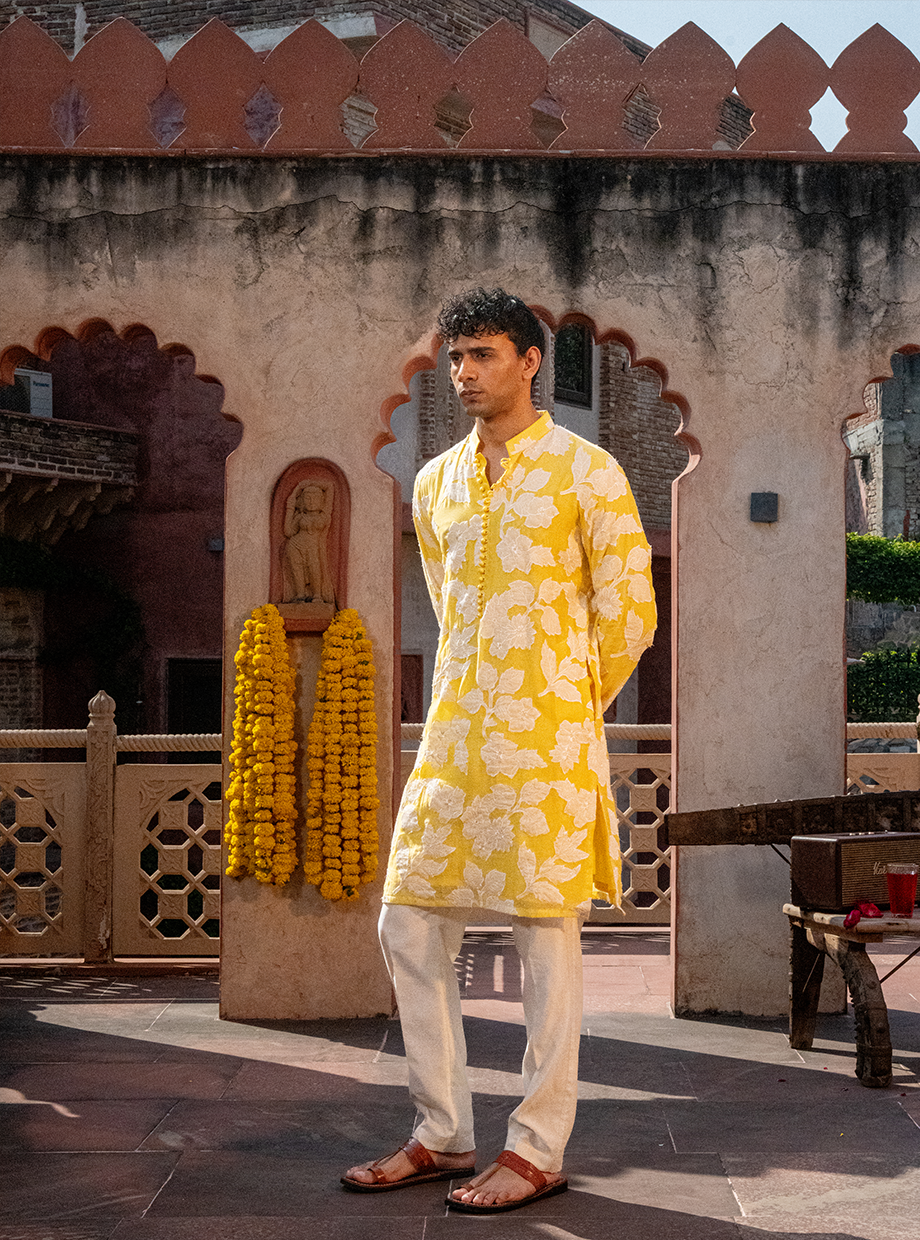 YOKE YELLOW CHANDERI KURTA WITH EGG WHITE FLORAL APPLIQUE WORK PAIRED WITH IVORY CHANDERI PANT Nafsstore