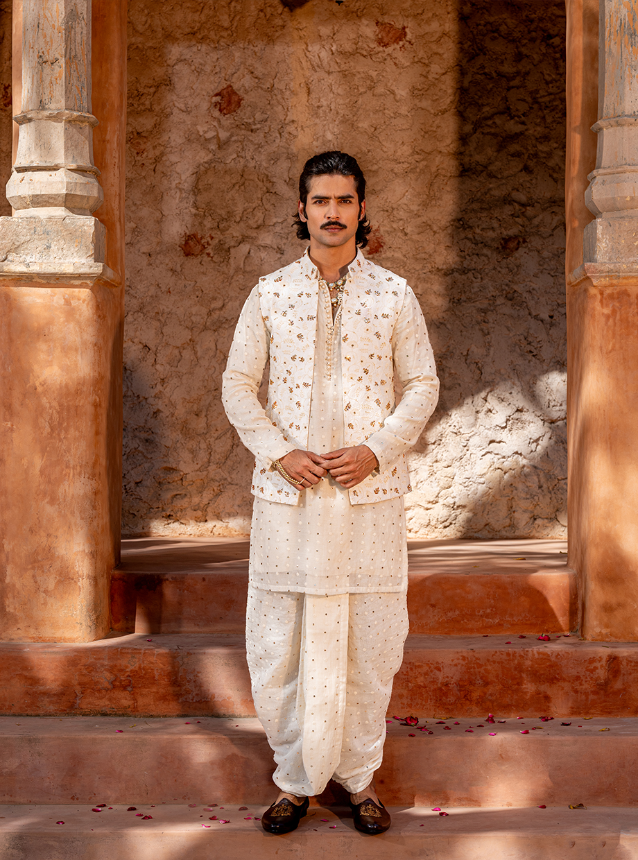 IVORY CHANDERI MUKAISH WORK KURTA + DHOTI PARIED WITH FLORAL EMBROIDERED BUNDI EXAGGERATED WITH MUKAISH FLORAL HAND EMBROIDERY Nafsstore