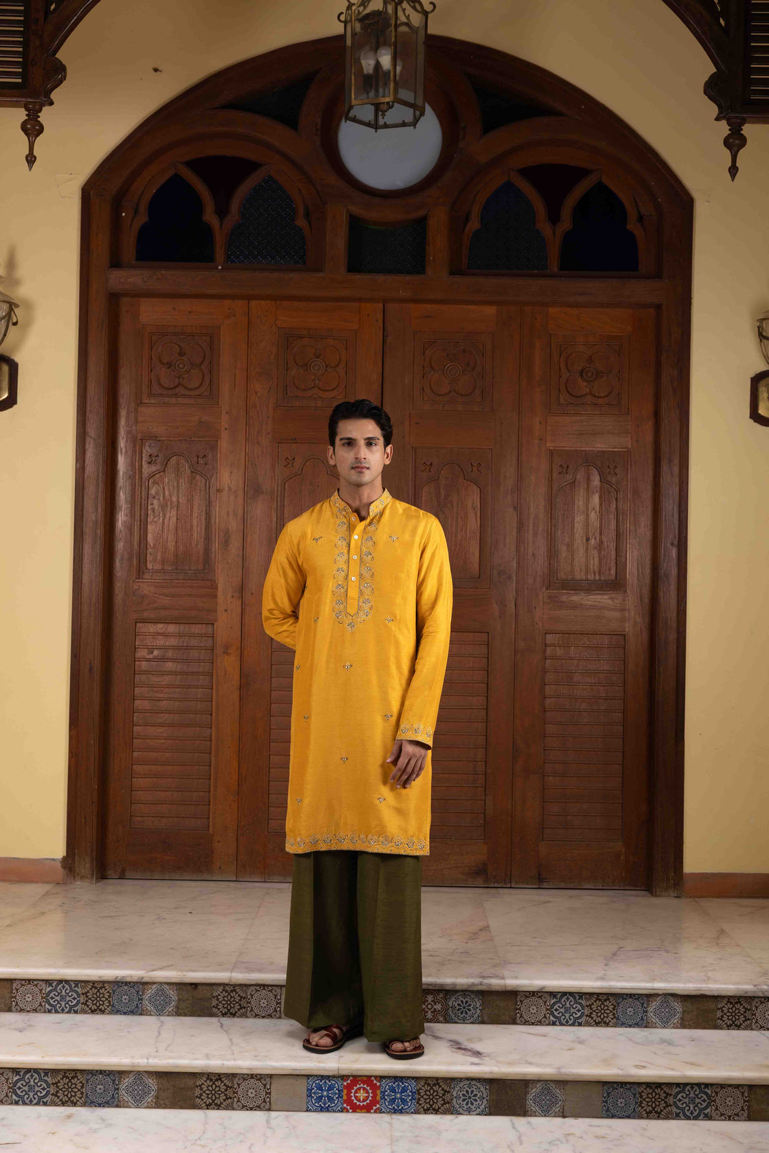 Amber yellow tussar silk kurta with tone on tone thread and gold kasab embroidery with moss green tussar silk flared pant Nafsstore