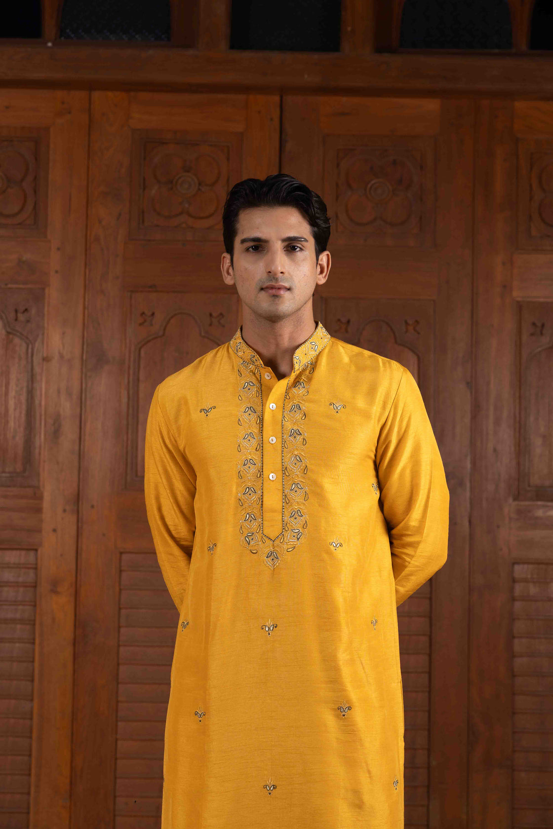 Amber yellow tussar silk kurta with tone on tone thread and gold kasab embroidery with moss green tussar silk flared pant Nafsstore