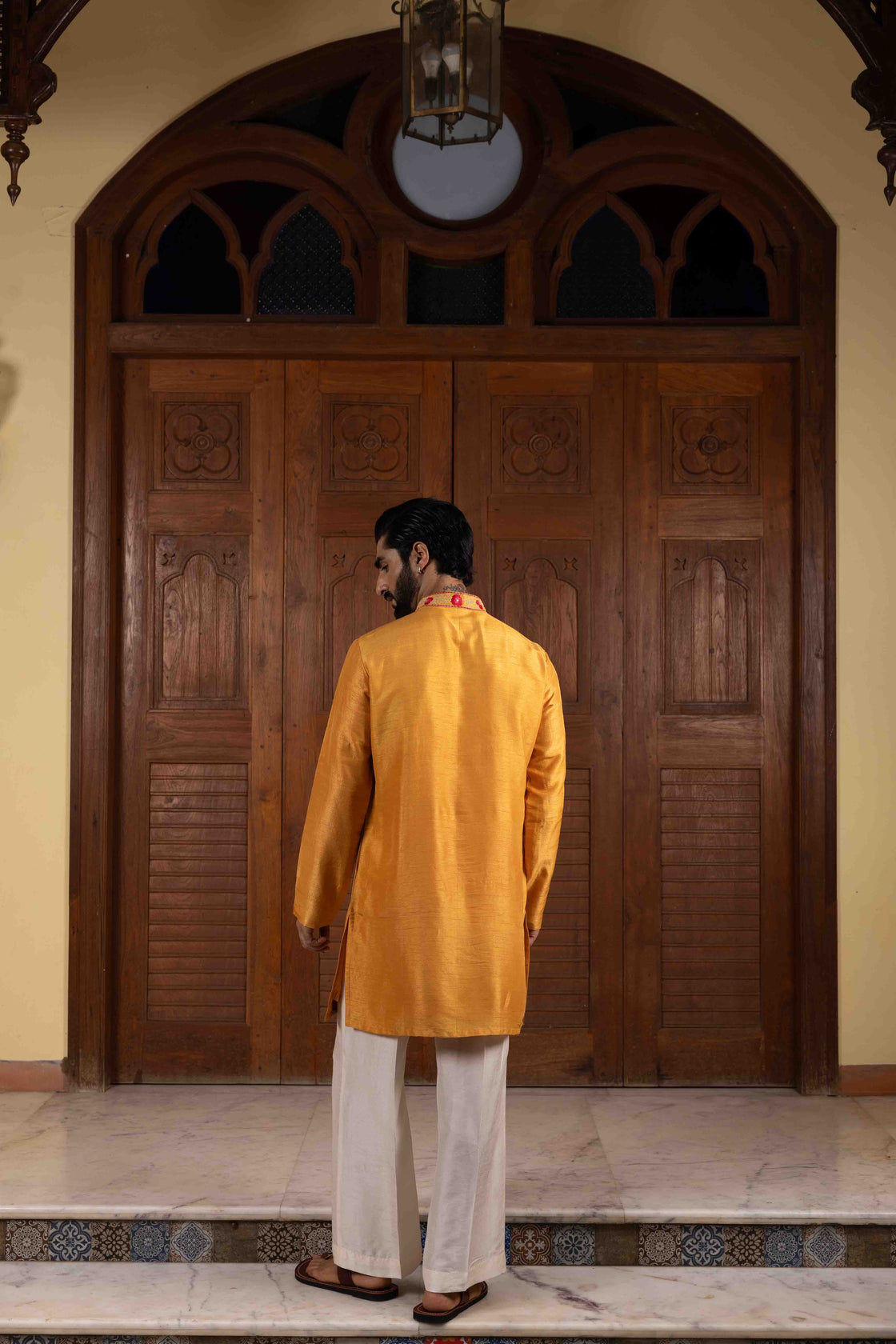 Fire yellow tussar silk kurta with floral thred with ombre red & pink kasab embroidery with ivory tussar flared pant Nafsstore