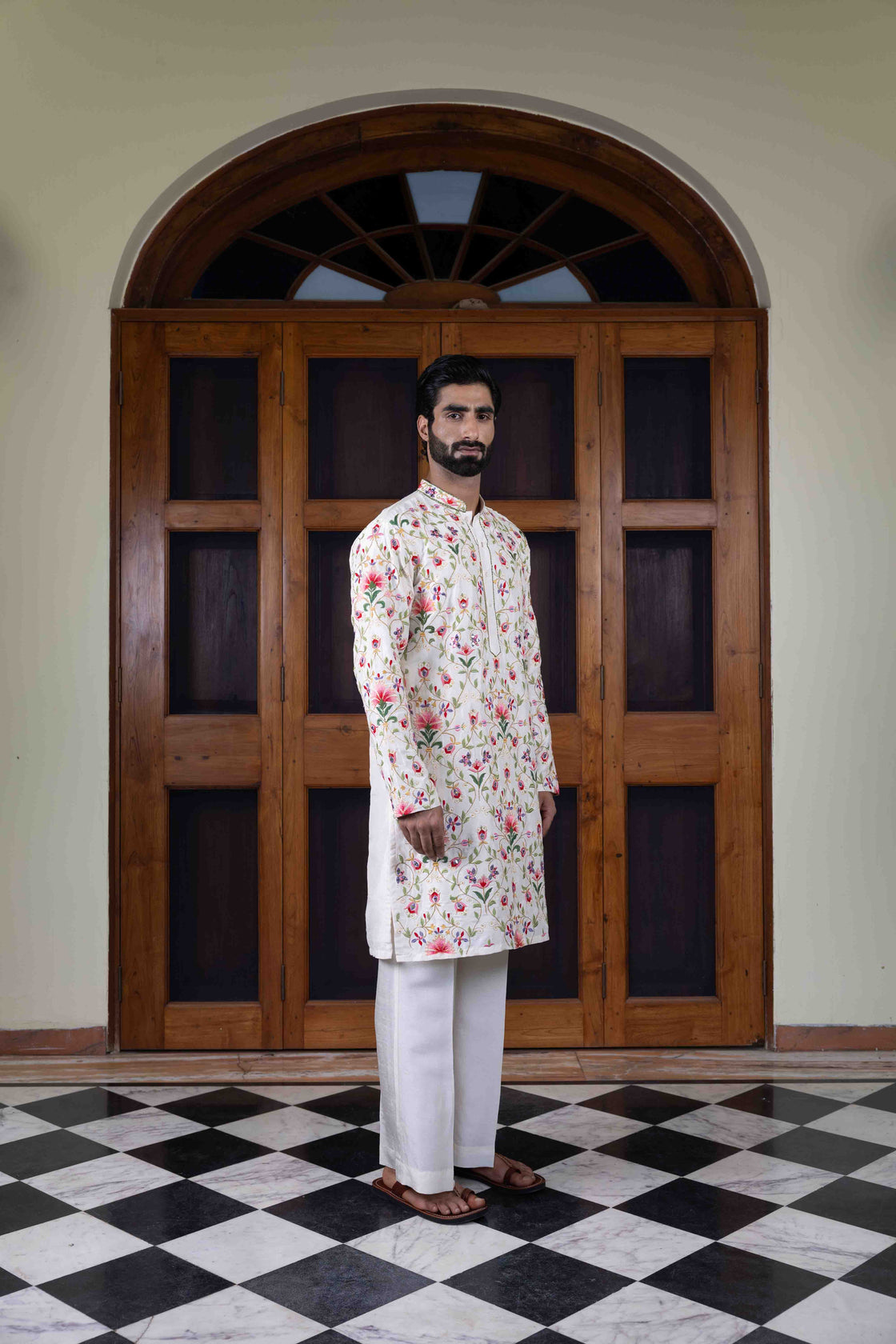 Ivory tussar silk kurta with multi-hued floral jaal resham and mirror work kurta with ivory tussar silk flared pant Nafsstore