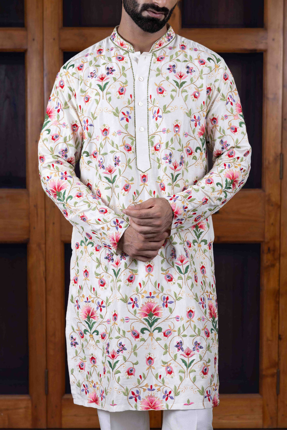 Ivory tussar silk kurta with multi-hued floral jaal resham and mirror work kurta with ivory tussar silk flared pant Nafsstore