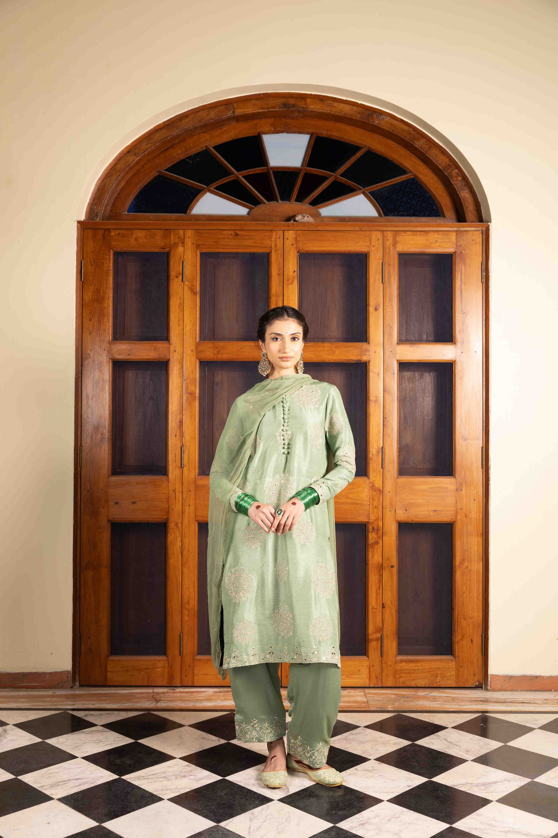 Moss green tussar silk polki buttoned resham, kasab and mirror work kurta paired with bemberg satin farshi salwar and chiffon scallop dupatta Nafsstore