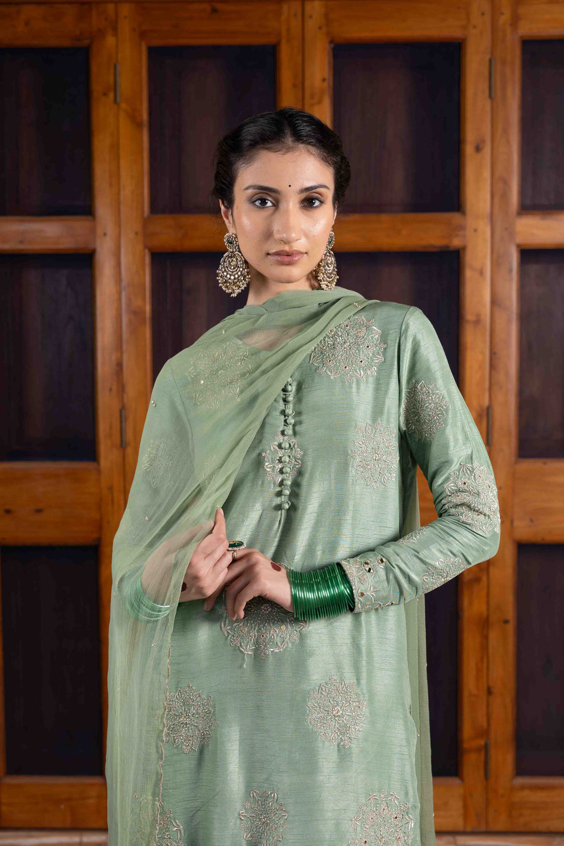 Moss green tussar silk polki buttoned resham, kasab and mirror work kurta paired with bemberg satin farshi salwar and chiffon scallop dupatta Nafsstore