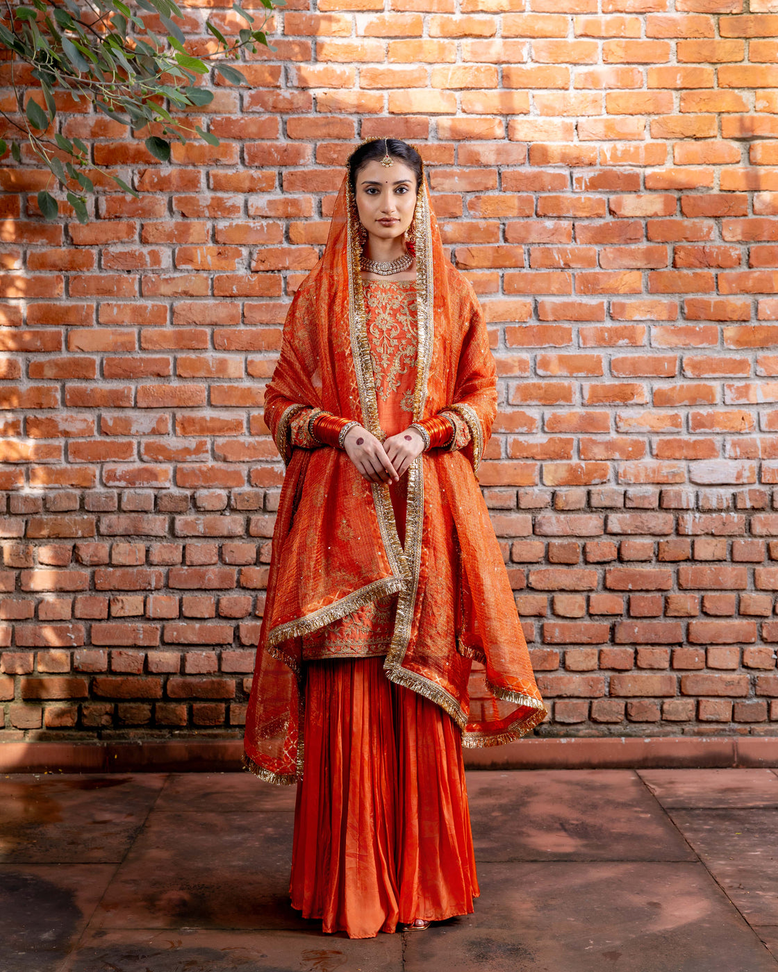 Rust tussar silk kurta with resham and kasab dori work paired with silk organza garara and textured tissue sequin and kiran edges dupatta Nafsstore