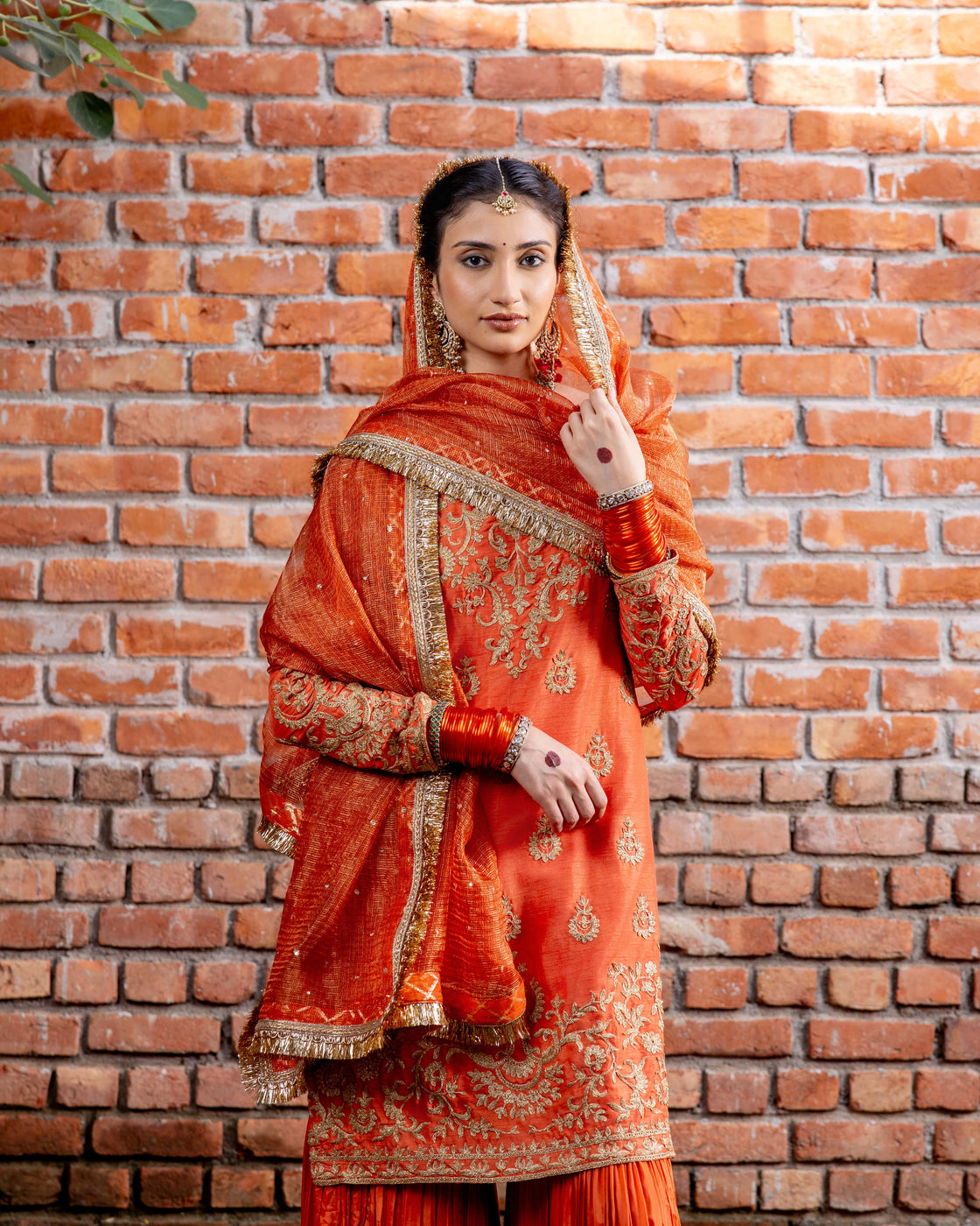 Rust tussar silk kurta with resham and kasab dori work paired with silk organza garara and textured tissue sequin and kiran edges dupatta Nafsstore
