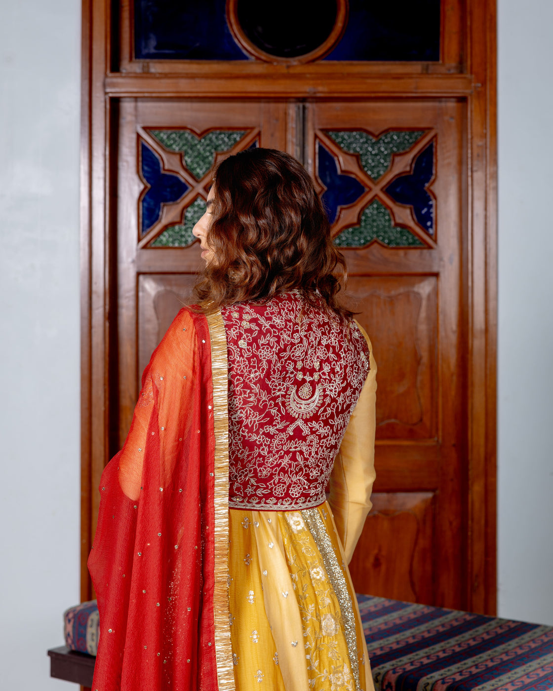 Canary yellow and dark rose Anarkali with brocade, sequin, heart zardozi motifs and sequin butti pannels paired with dark rose zardozi and kasab jaal work koti and chiffon badla work and kiran edges dupatta Nafsstore
