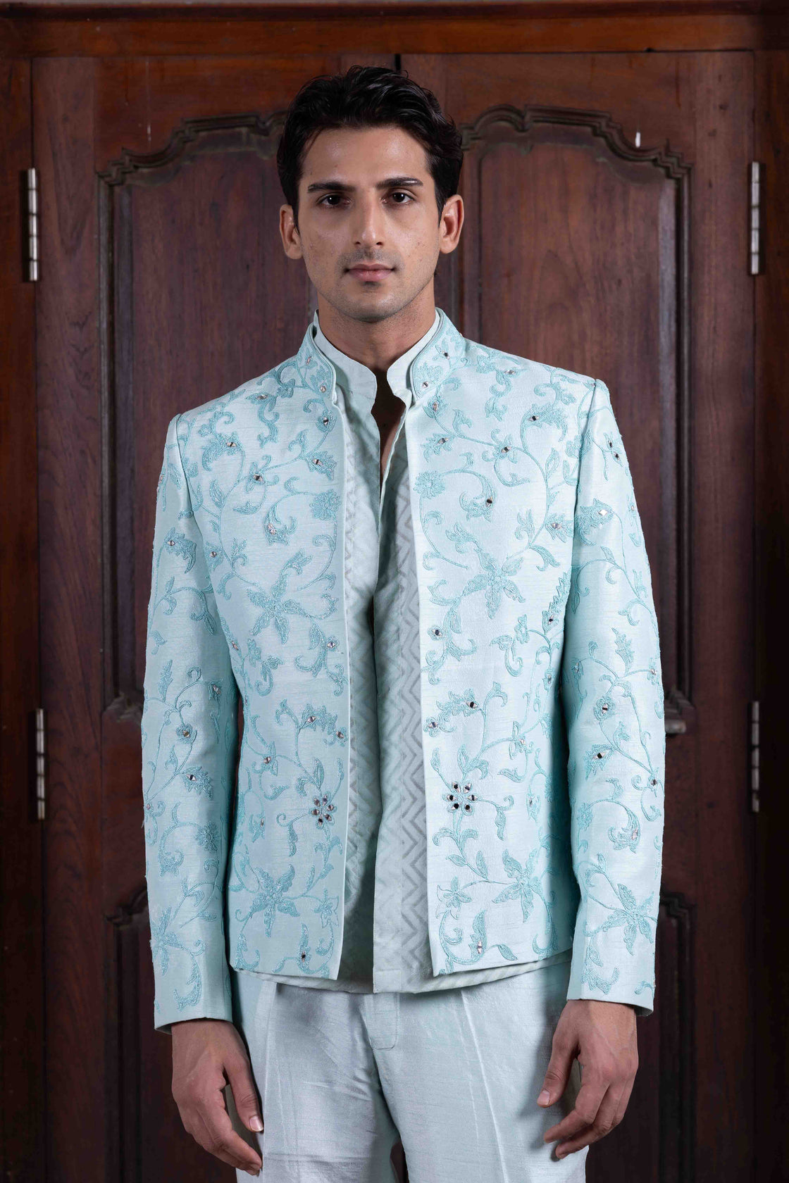 Aqua tussar silk jacket with resham, kasab and mirror dori work paired with chevron chanderi mandarin collar shirt and tussar silk flared pant Nafsstore