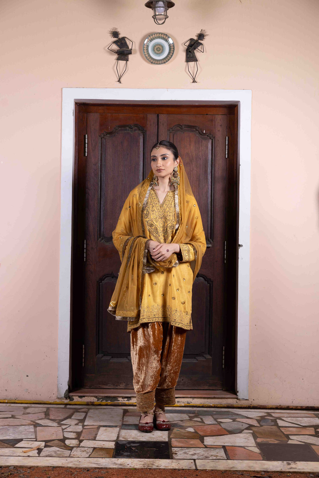 Butter scotch tussar silk anti-fit kurta with sequin, zardozi and kasab work paired with velvet embroidered salwar and soft net mirror and sequin butti with kiran edges dupatta Nafsstore