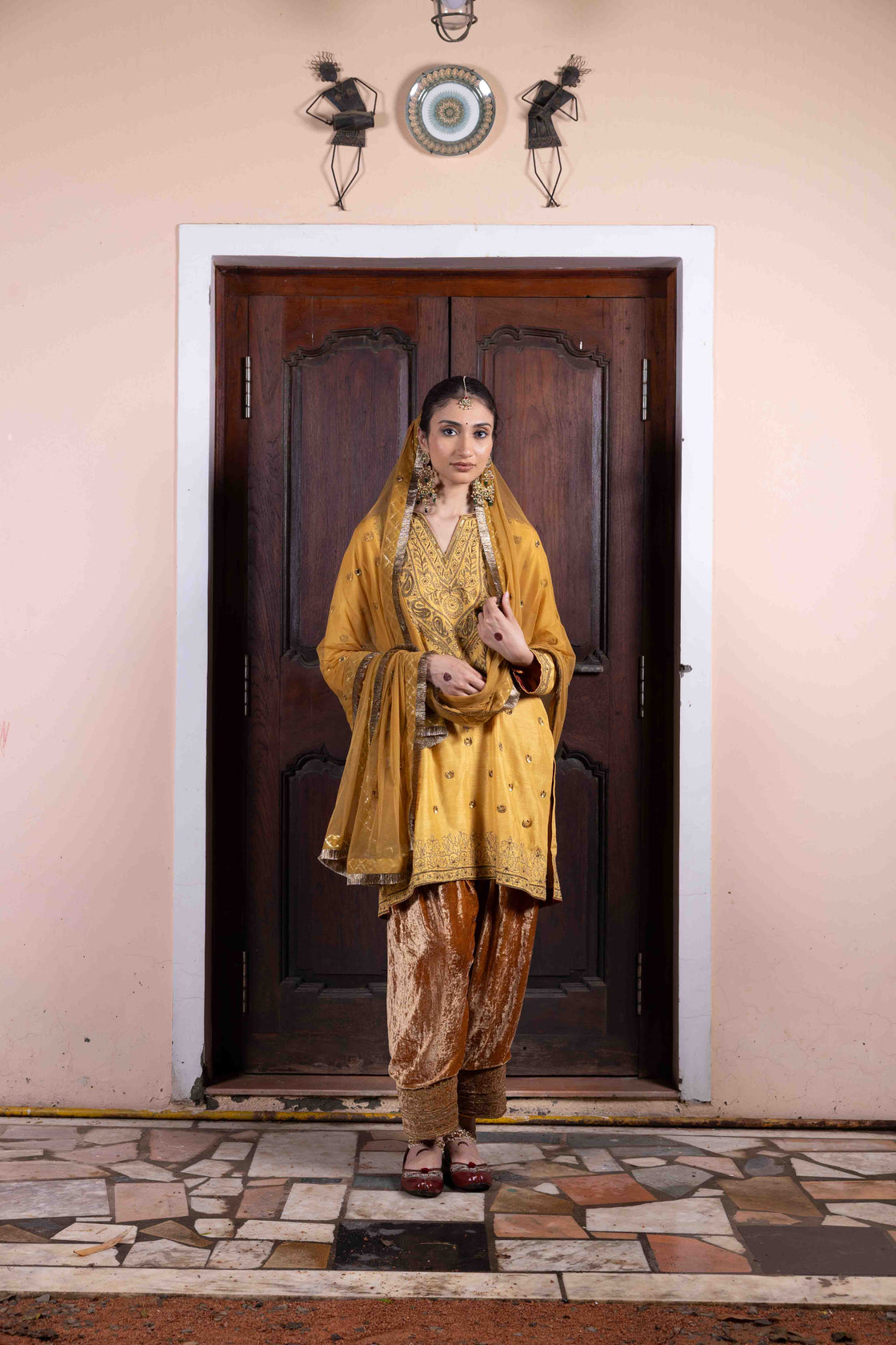Butter scotch tussar silk anti-fit kurta with sequin, zardozi and kasab work paired with velvet embroidered salwar and soft net mirror and sequin butti with kiran edges dupatta Nafsstore