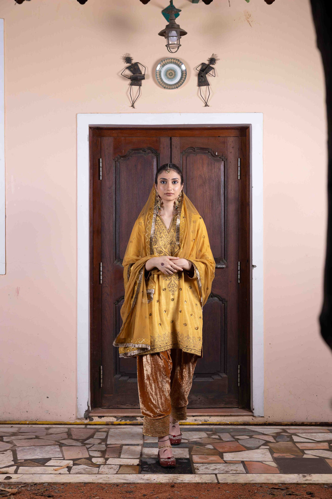 Butter scotch tussar silk anti-fit kurta with sequin, zardozi and kasab work paired with velvet embroidered salwar and soft net mirror and sequin butti with kiran edges dupatta Nafsstore
