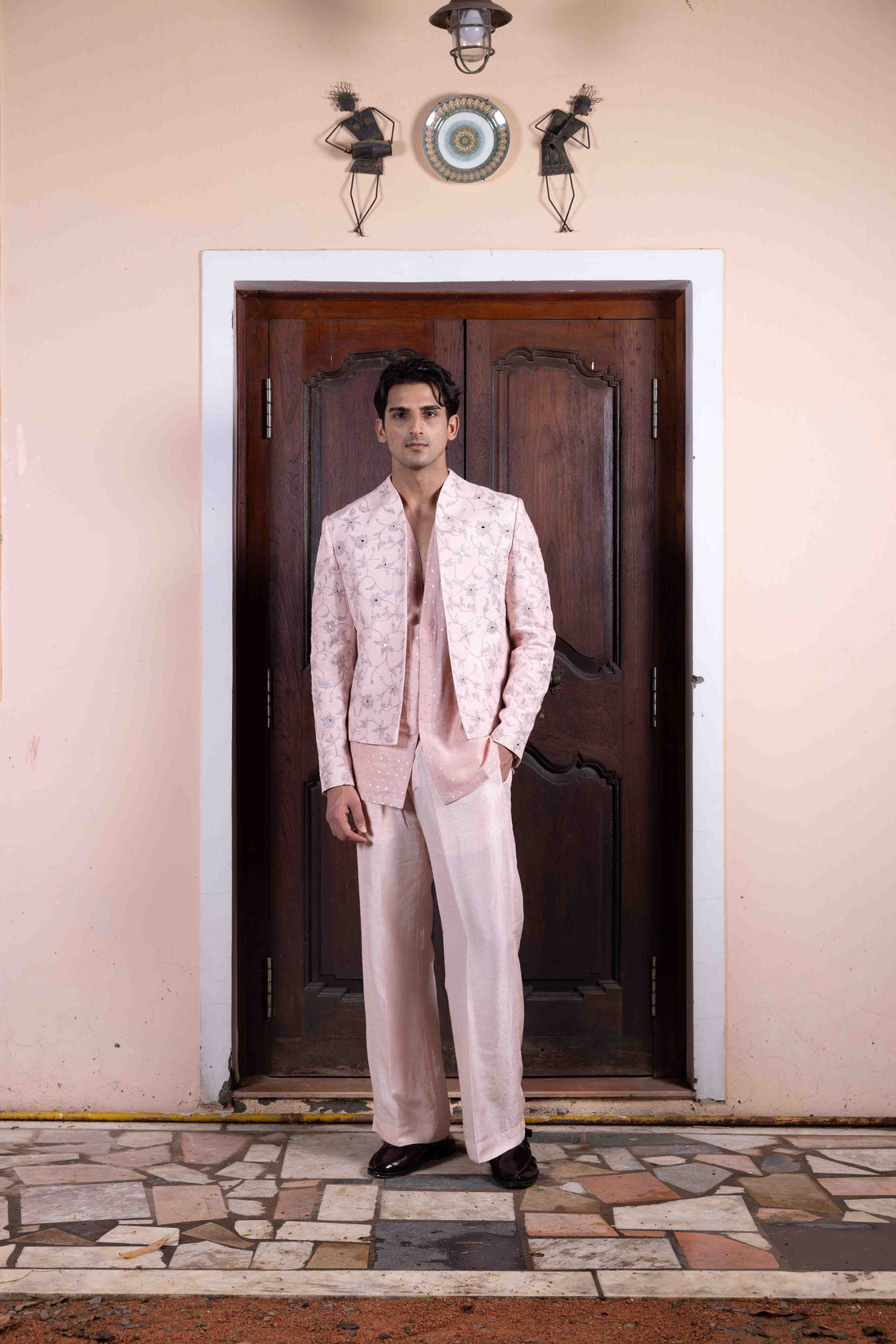 Salmon pink tussar silk jacket with resham, kasab and mirror dori work paired with mettalic polka dotted chanderi shirt and tussar silk flared pant Nafsstore