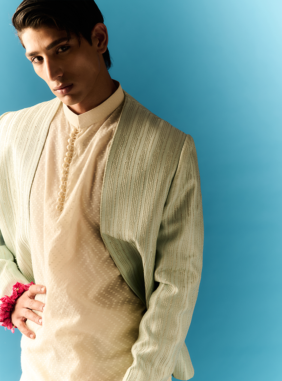 IVORY CHANDERI CHEVRON DOTTED JACQUARD KURTA AND CHANDERI PANT PAIRED WITH MINT ZARI EMBROIDERED JACKET My Store