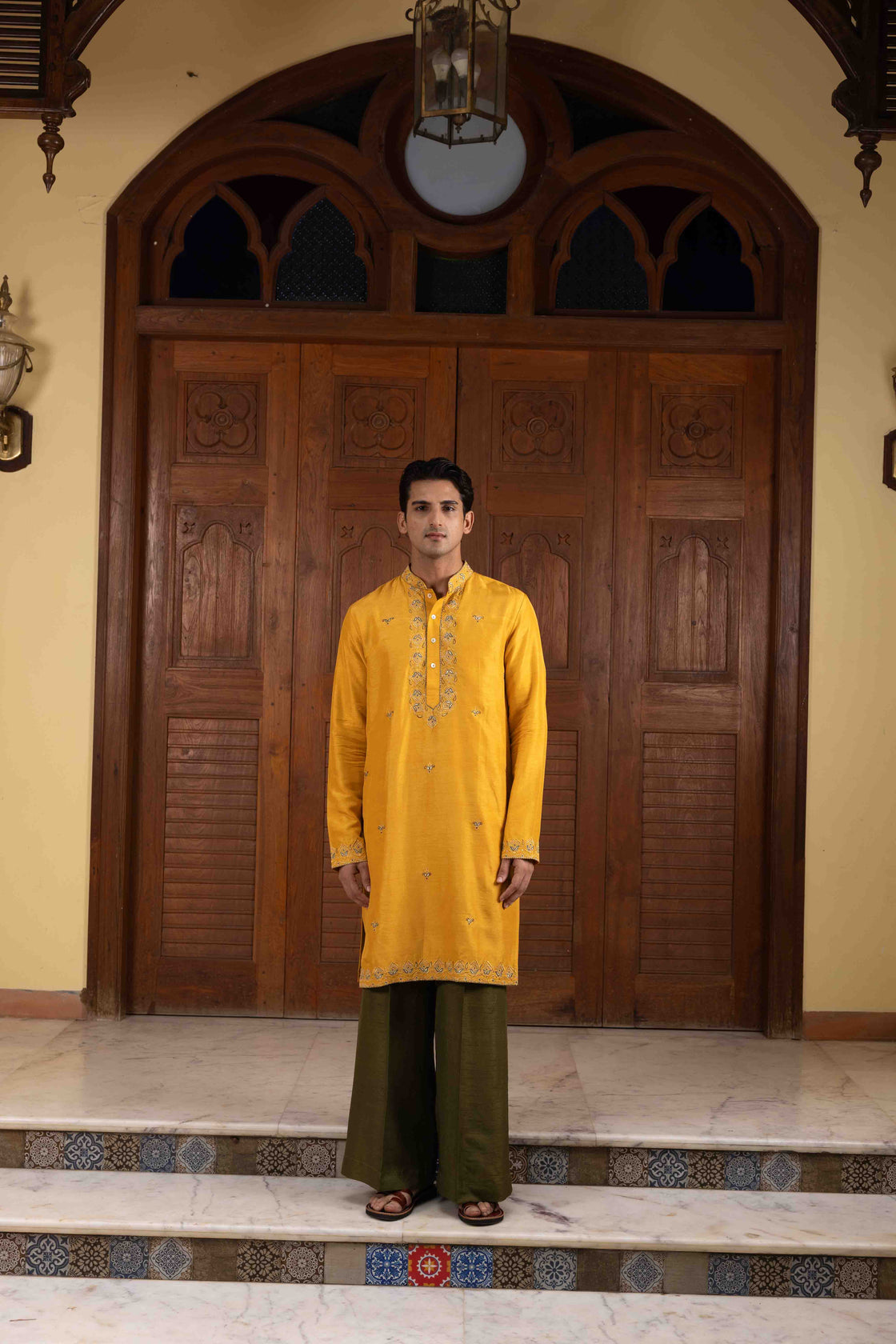 Amber yellow tussar silk kurta with tone on tone thread and gold kasab embroidery with moss green tussar silk flared pant Nafsstore