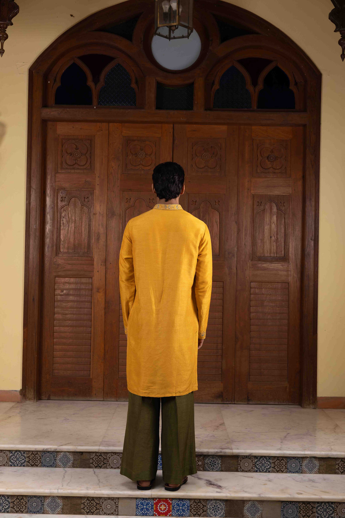 Amber yellow tussar silk kurta with tone on tone thread and gold kasab embroidery with moss green tussar silk flared pant Nafsstore