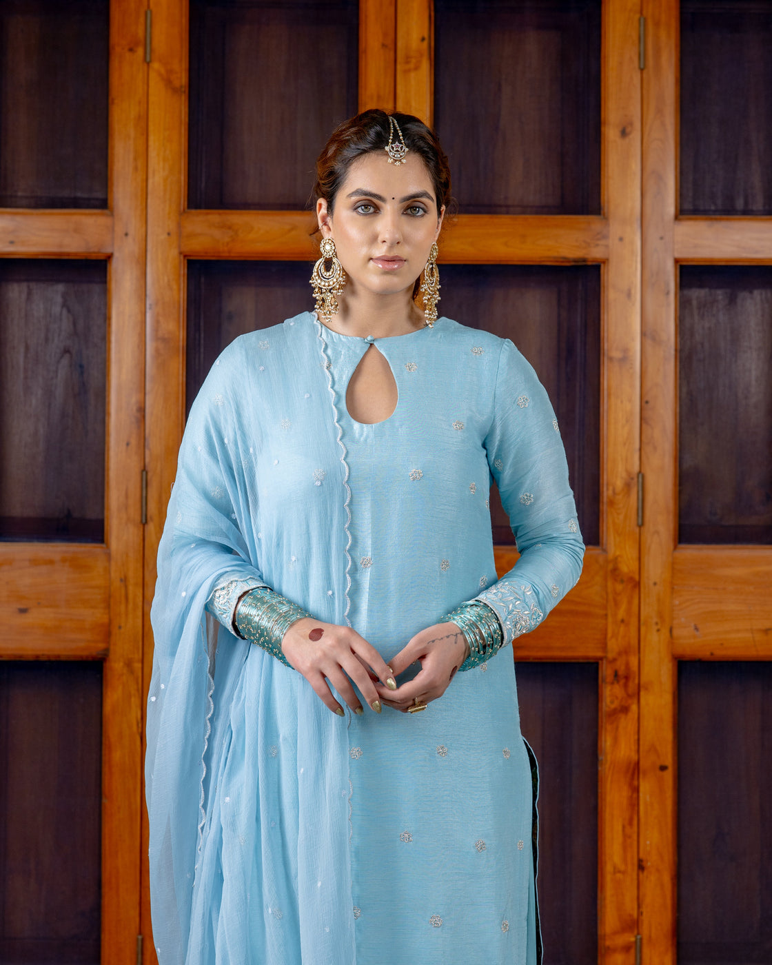 Ferozi tussar silk key hole kurta with resham, kasab zardozi work paired with bemberg satin farshi salwar and chiffon scallop dupatta Nafsstore