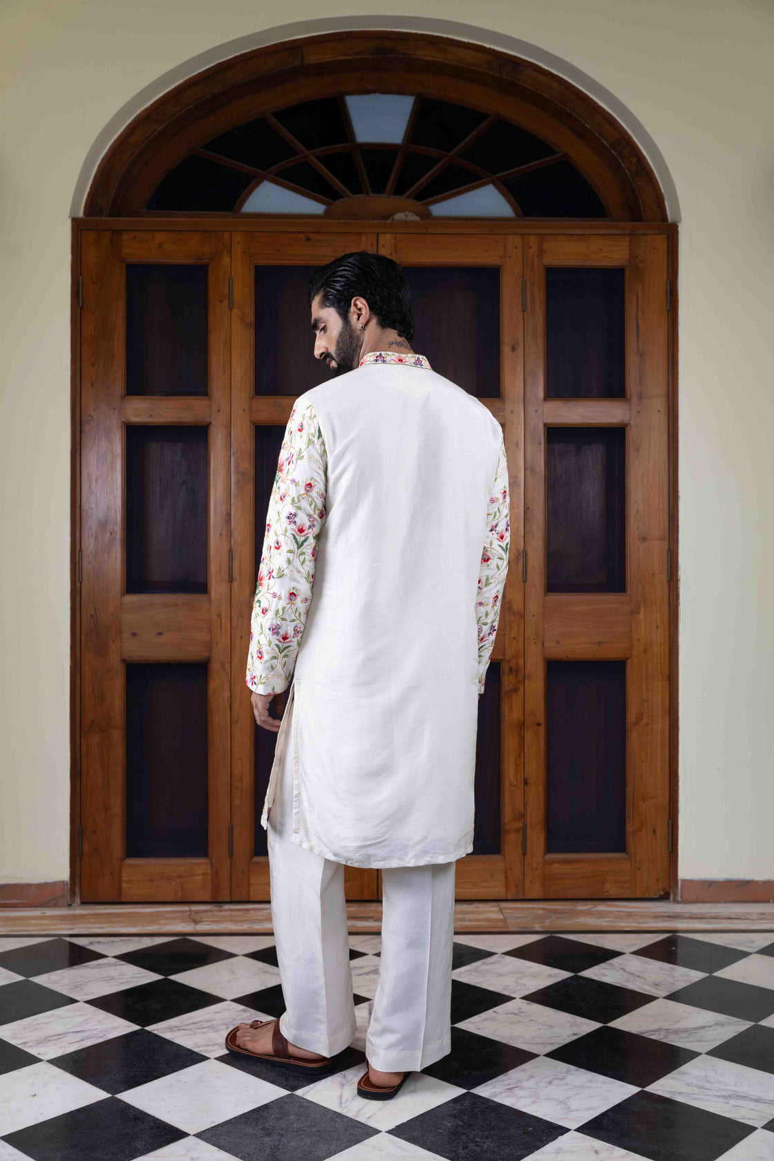 Ivory tussar silk kurta with multi-hued floral jaal resham and mirror work kurta with ivory tussar silk flared pant Nafsstore