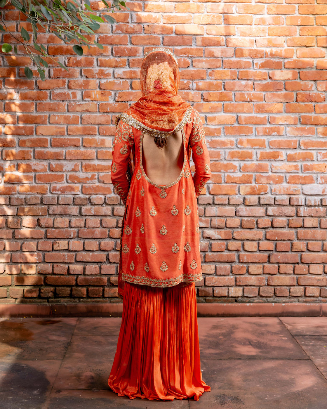 Rust tussar silk kurta with resham and kasab dori work paired with silk organza garara and textured tissue sequin and kiran edges dupatta Nafsstore