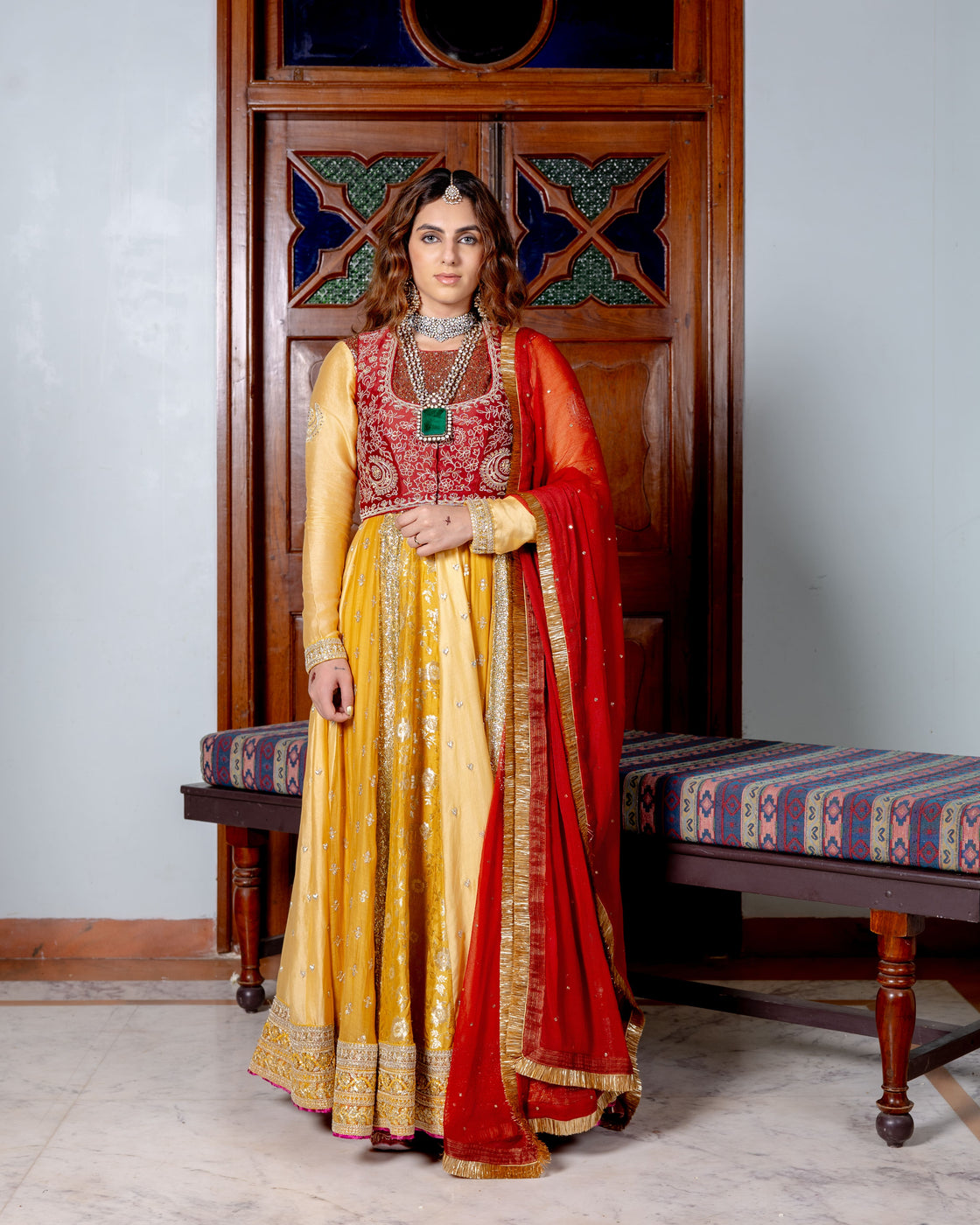 Canary yellow and dark rose Anarkali with brocade, sequin, heart zardozi motifs and sequin butti pannels paired with dark rose zardozi and kasab jaal work koti and chiffon badla work and kiran edges dupatta Nafsstore