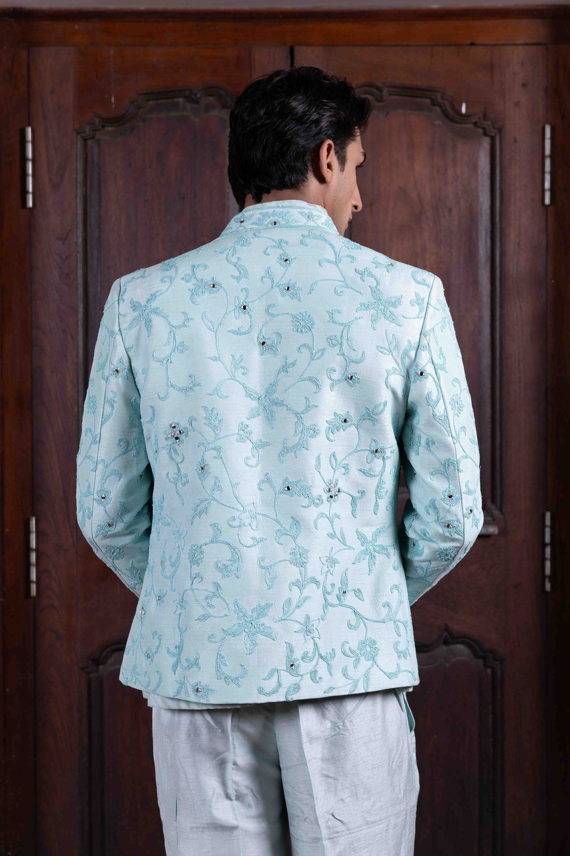 Aqua tussar silk jacket with resham, kasab and mirror dori work paired with chevron chanderi mandarin collar shirt and tussar silk flared pant Nafsstore
