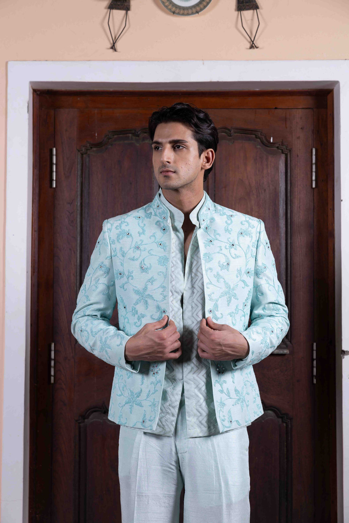 Aqua tussar silk jacket with resham, kasab and mirror dori work paired with chevron chanderi mandarin collar shirt and tussar silk flared pant Nafsstore