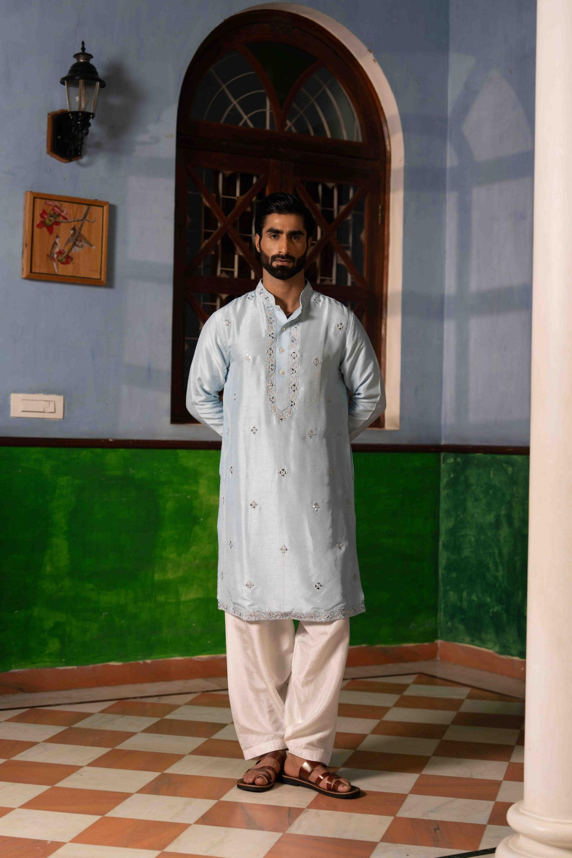 Sky blue tussar silk kurta with silver kasab and mirror work paired with white tussar silk pajama Nafsstore