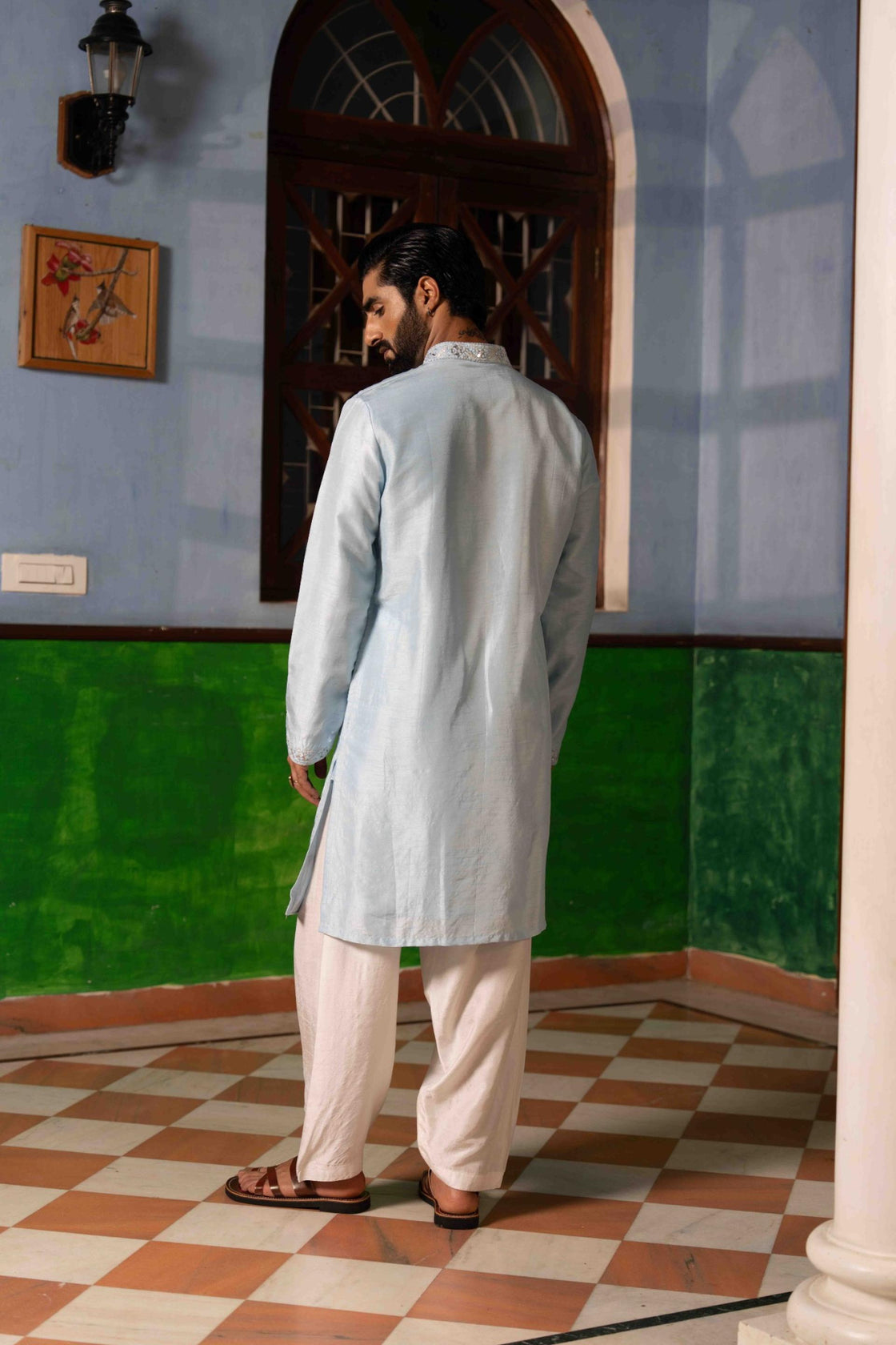 Sky blue tussar silk kurta with silver kasab and mirror work paired with white tussar silk pajama Nafsstore