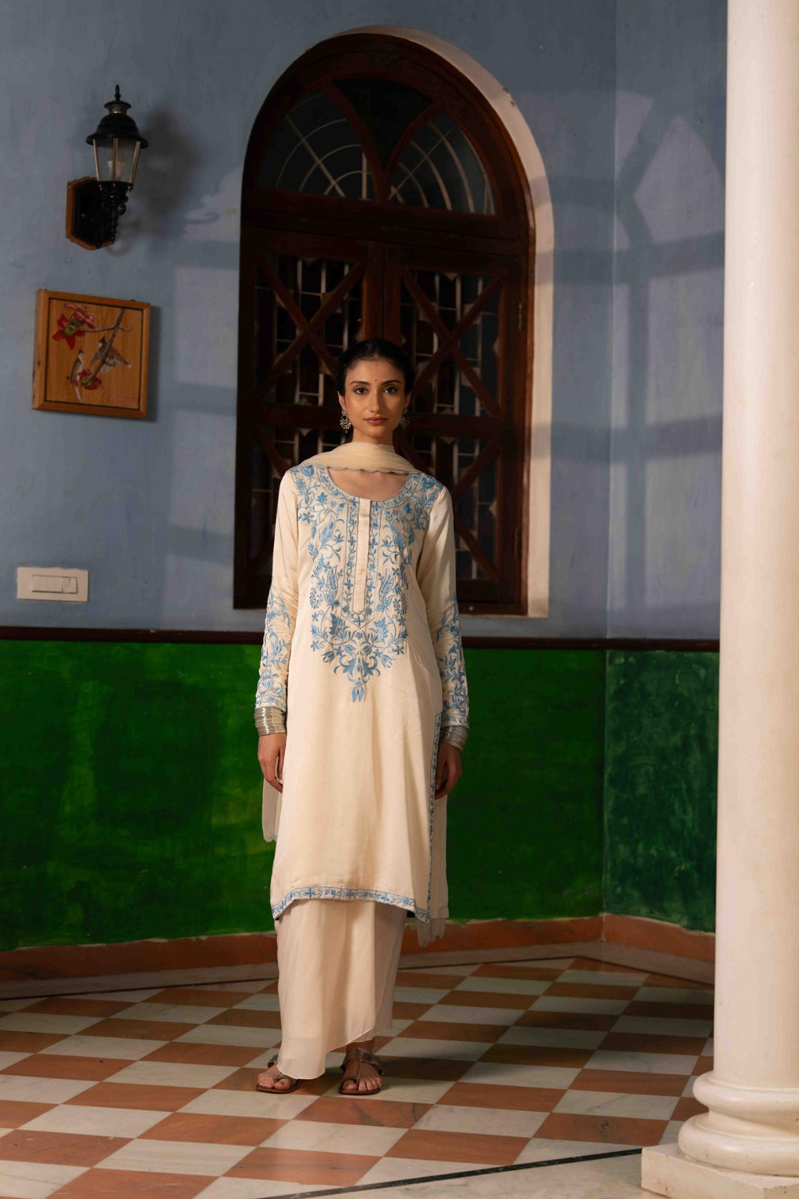 Ivory bemberg satin kurta with sky blue resham embroidery paired with crepe draped dhoti and chiffon scallop dupatta Nafsstore