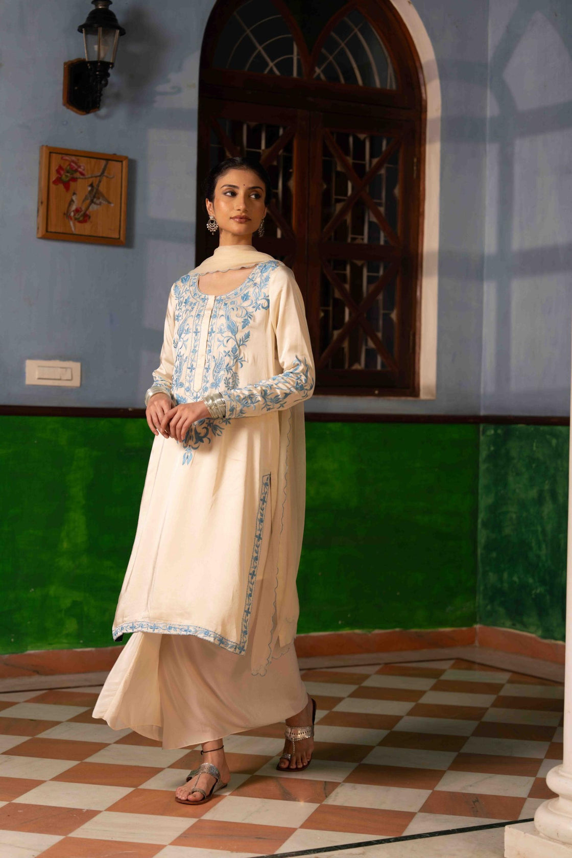Ivory bemberg satin kurta with sky blue resham embroidery paired with crepe draped dhoti and chiffon scallop dupatta Nafsstore