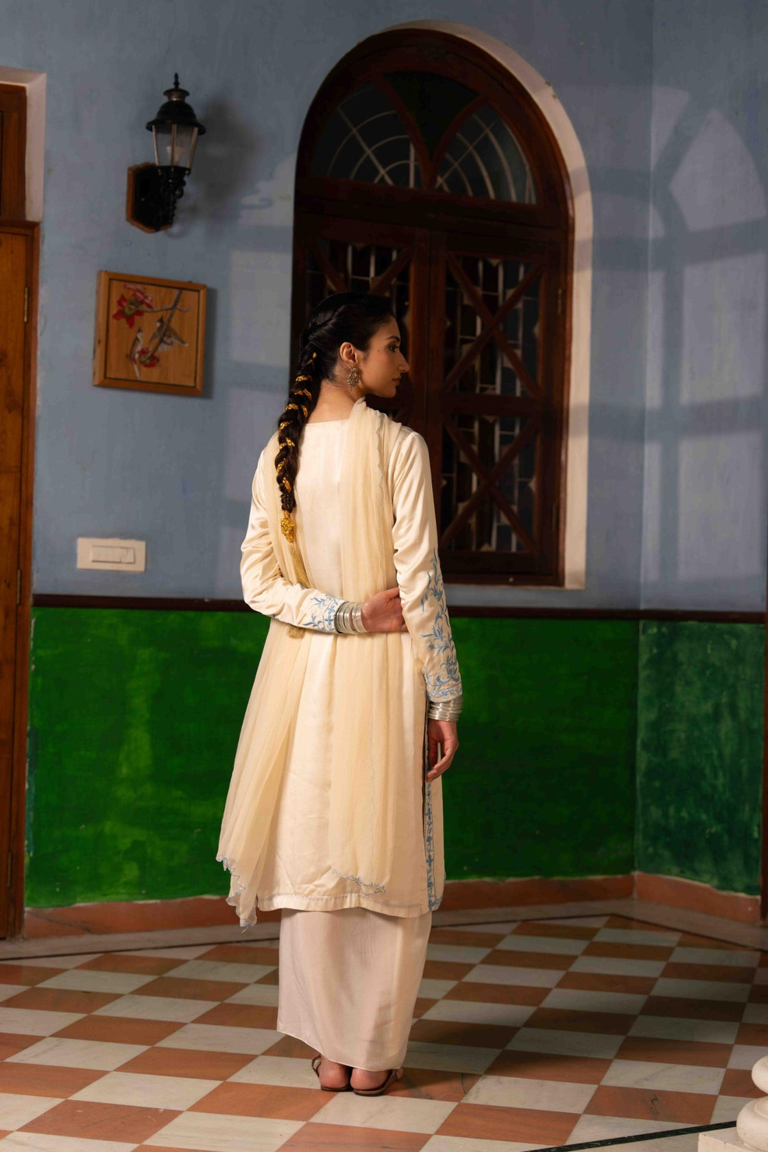 Ivory bemberg satin kurta with sky blue resham embroidery paired with crepe draped dhoti and chiffon scallop dupatta Nafsstore